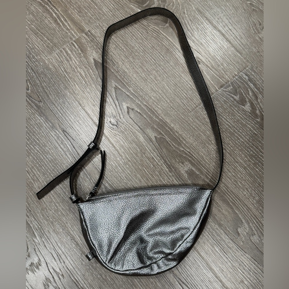 The Sak Metallic Silver Crescent Crossbody Bag